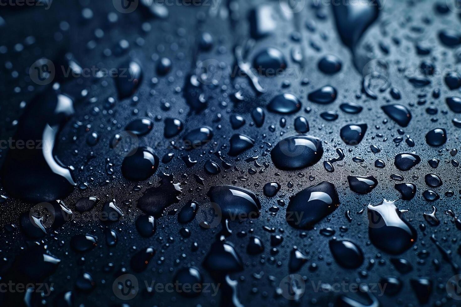 Close-up of glistening water droplets on a dark surface, creating a captivating visual of texture and light. photo