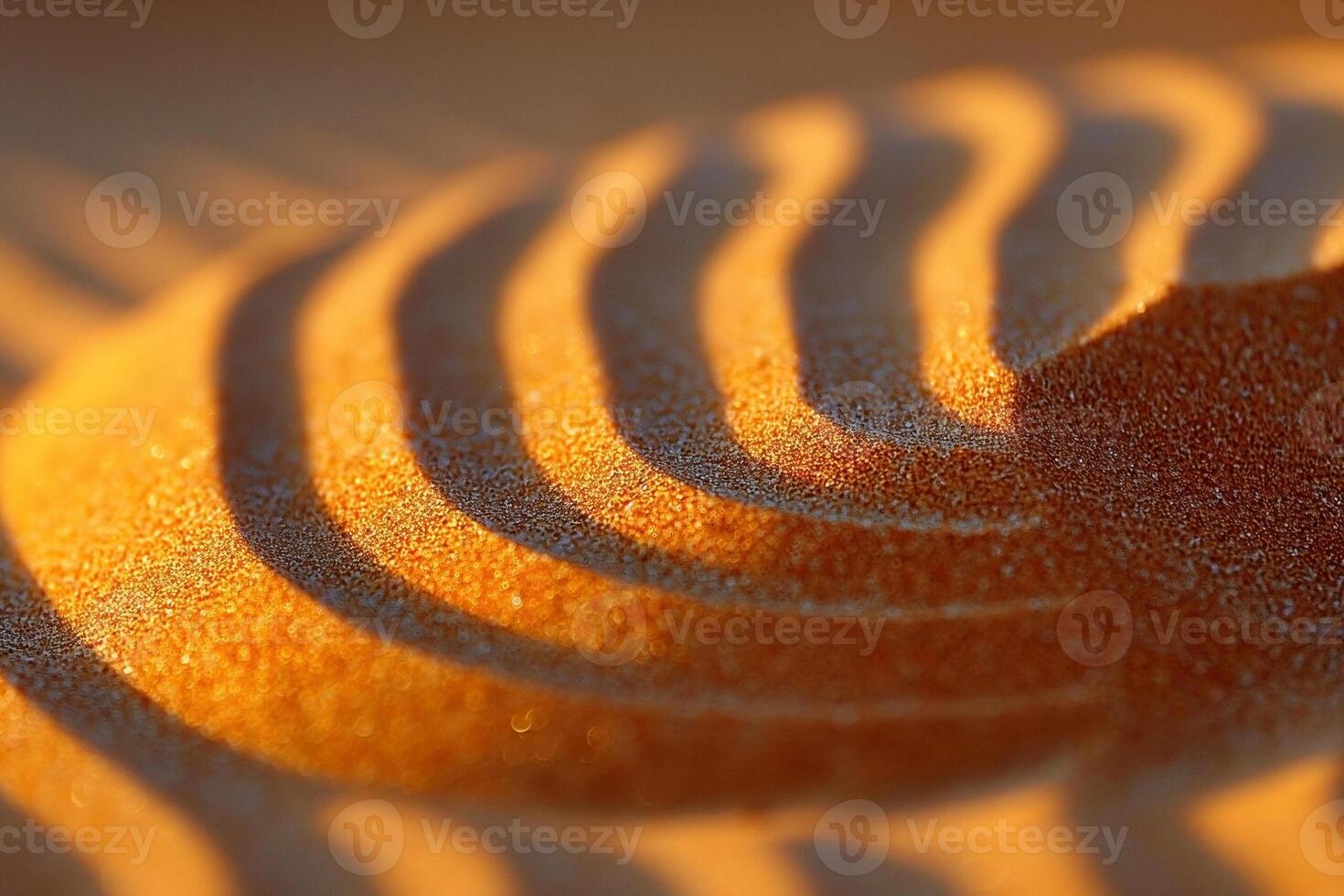 Close-up of golden sand patterns creating a captivating play of light and shadow. photo