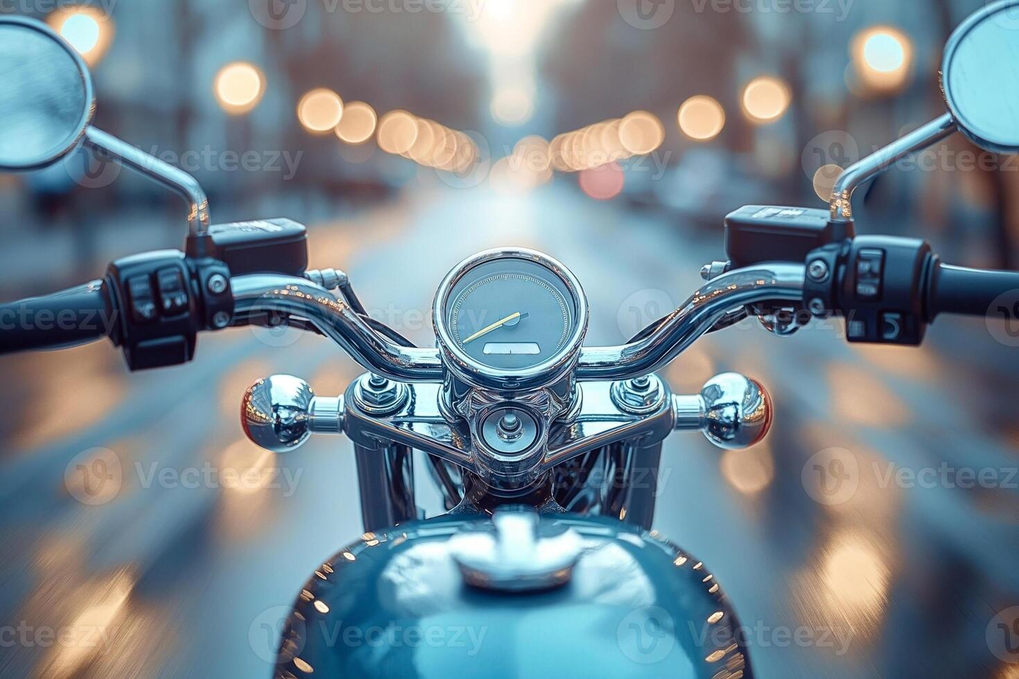 Close-up of motorcycle handlebars with a speedometer, reflecting city lights at dusk. photo