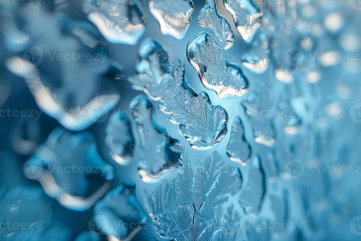 Close-up of intricate ice crystals on a blue background, creating a stunning frost pattern. photo