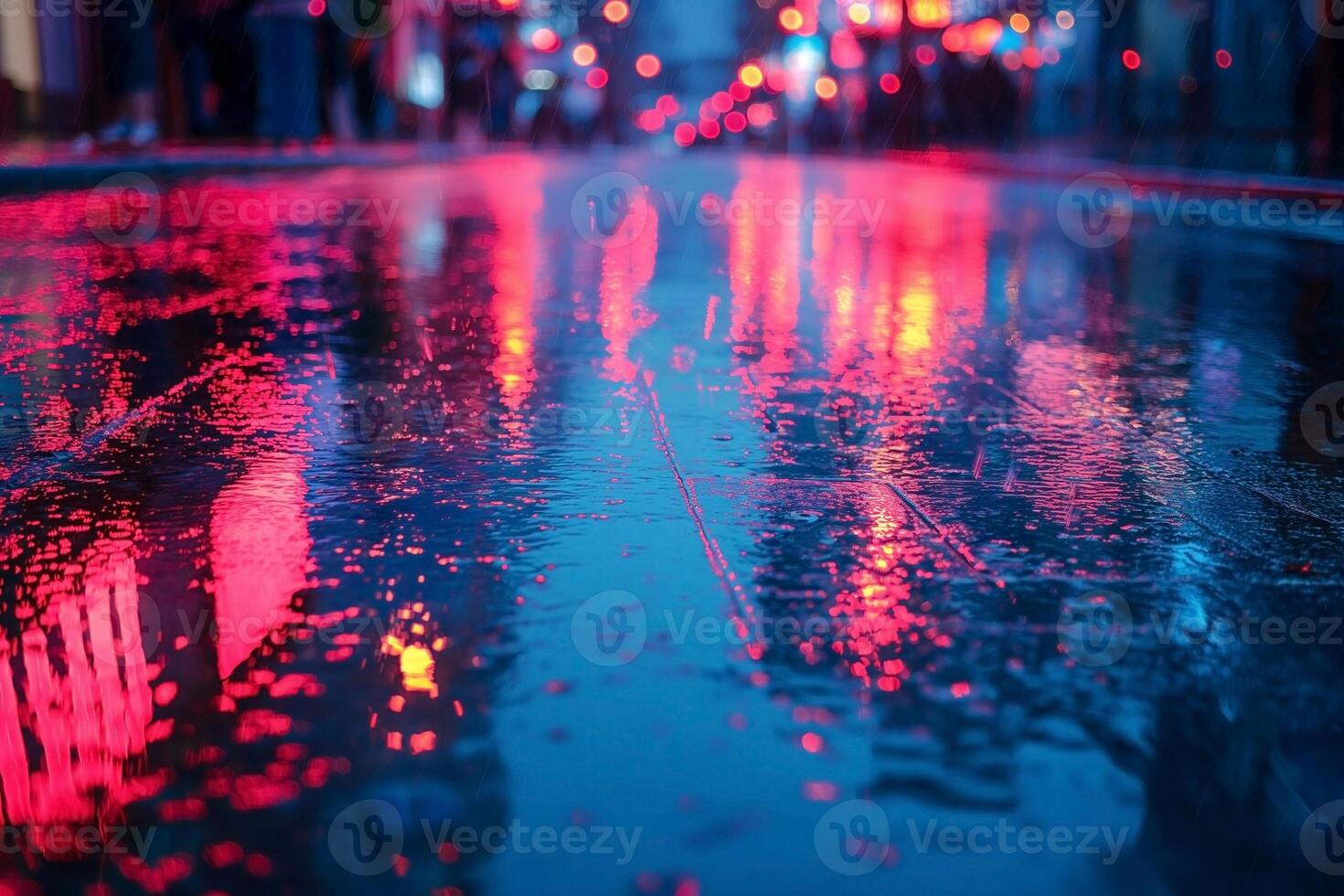 A vibrant urban scene reflecting neon lights on a wet pavement at night. photo