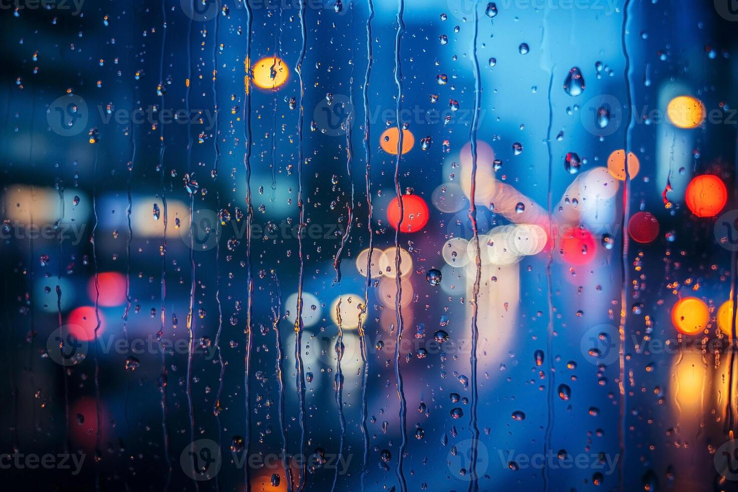 A mesmerizing view of city lights blurred by raindrops on glass, creating a dreamy atmosphere during a rainy evening. photo