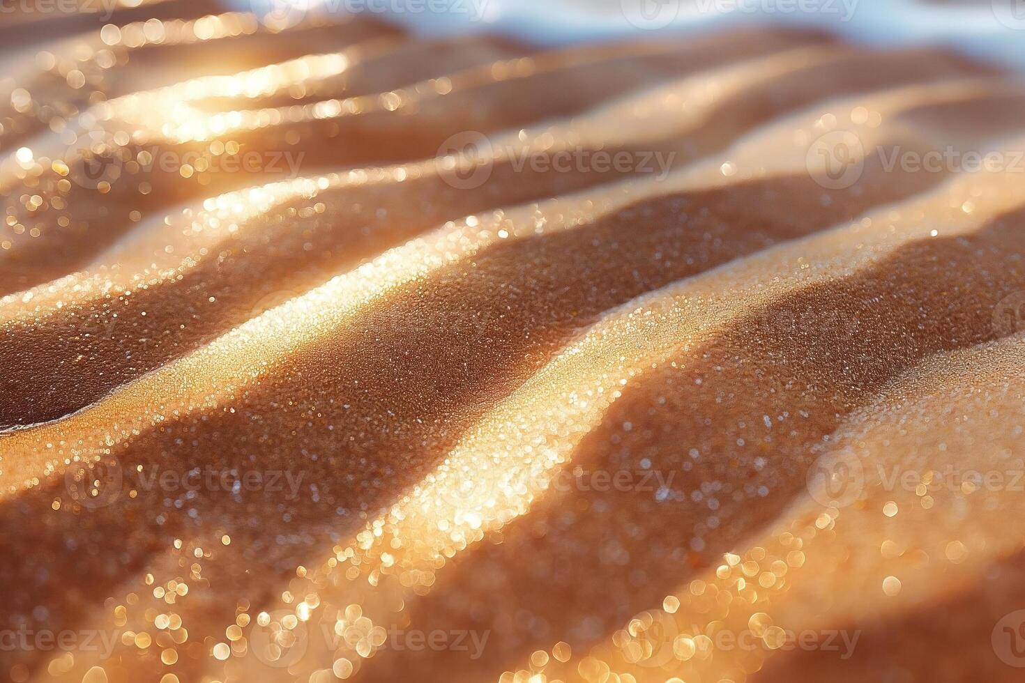 Beautiful close-up of shimmering golden sand, glistening under warm sunlight, creating a serene and tranquil beach atmosphere. photo