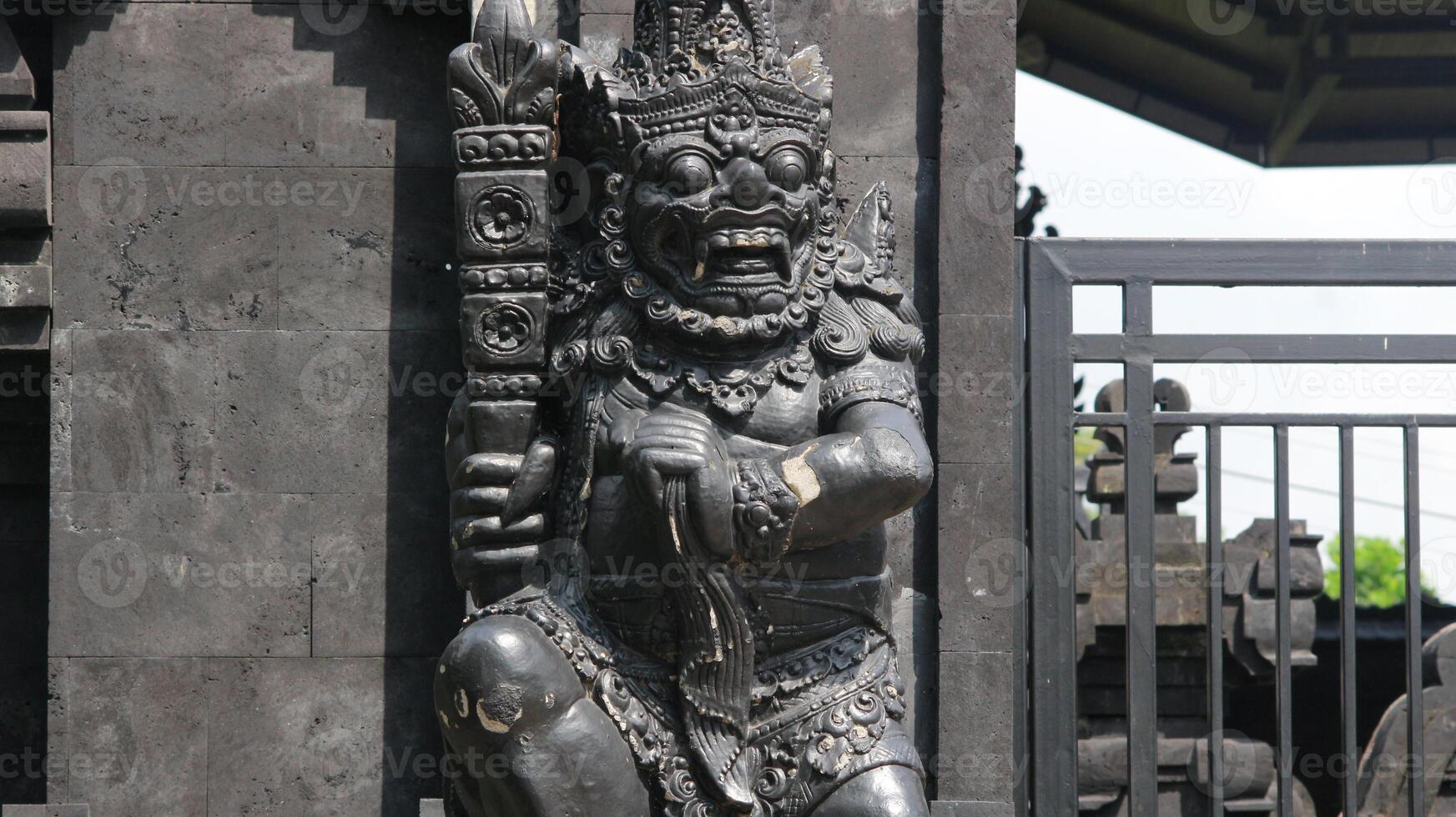 Balinese Hindu Temple, traditional Balinese building architecture with beautiful carved statues, photo