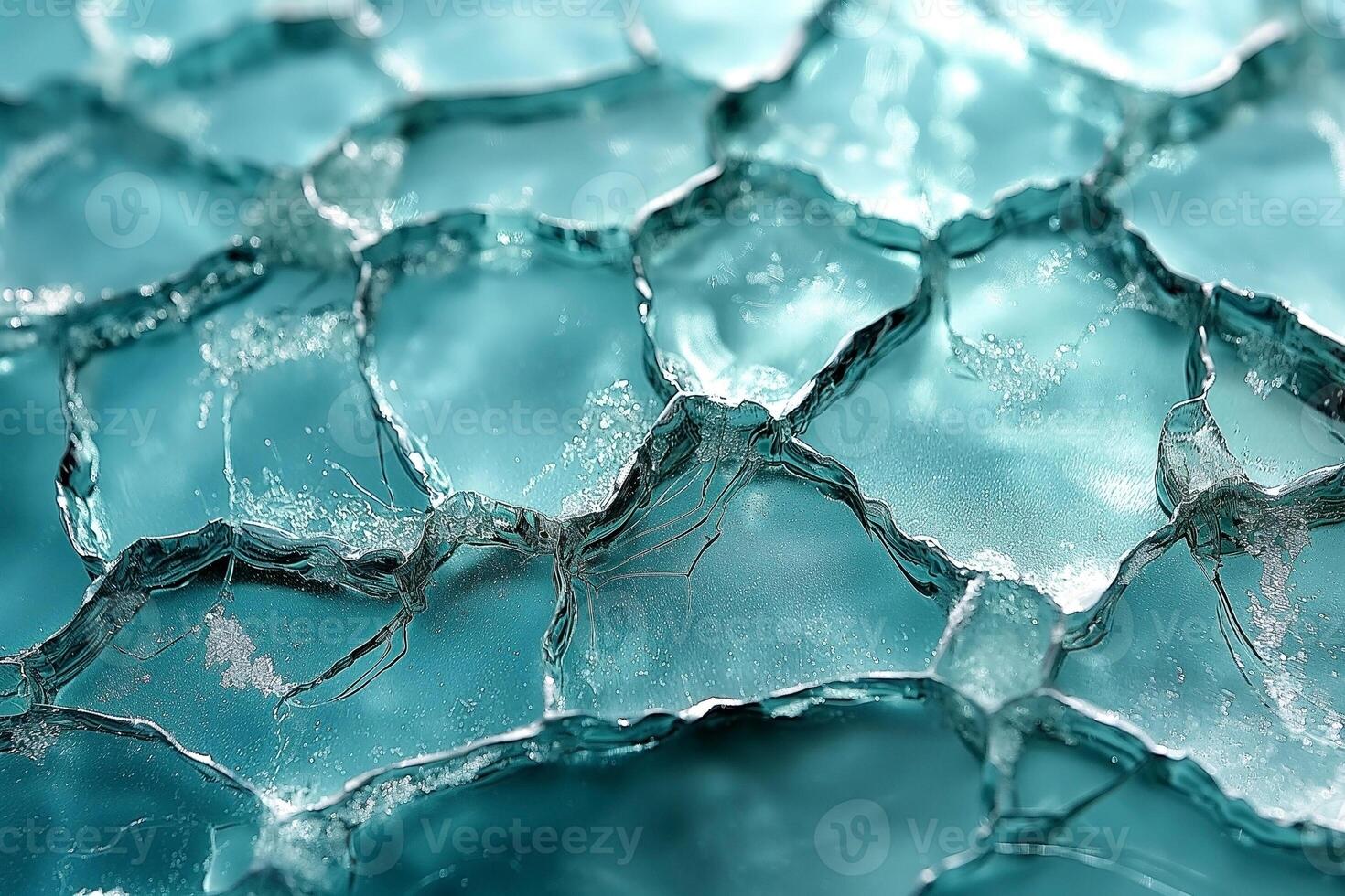Intricate close-up of frosty ice formations, showcasing delicate patterns and shimmering blue hues. photo