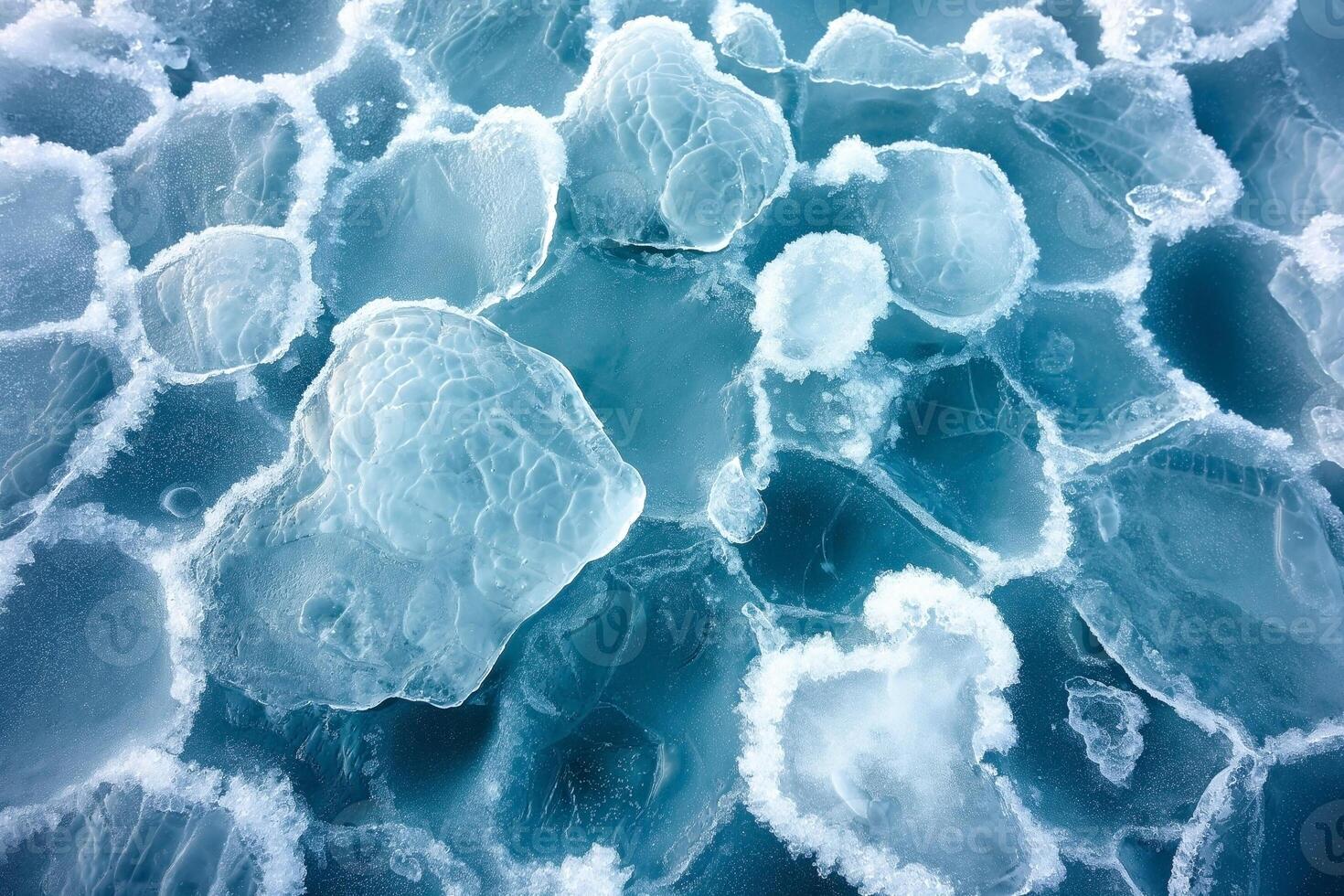 Close-up of icy blue sea ice with unique textures and shapes, creating a serene winter atmosphere. photo