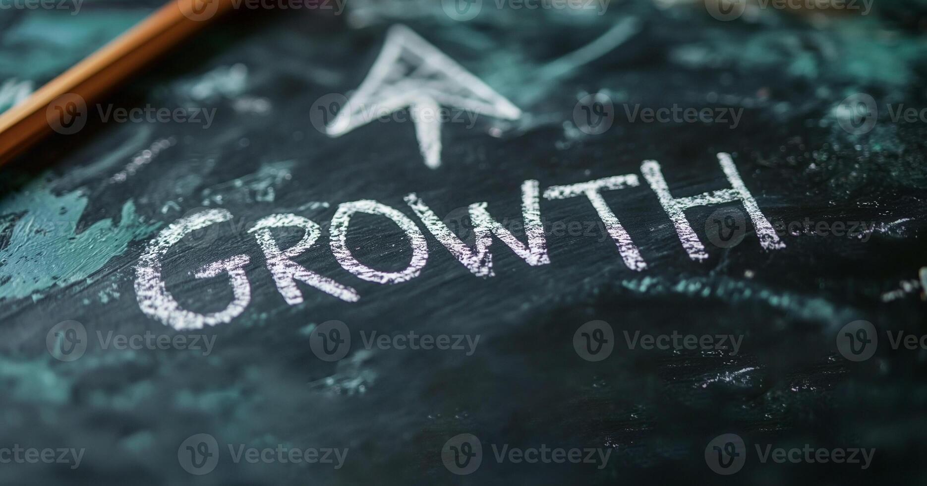 A chalkboard displaying the word 'Growth' with an upward arrow, symbolizing progress and development. photo