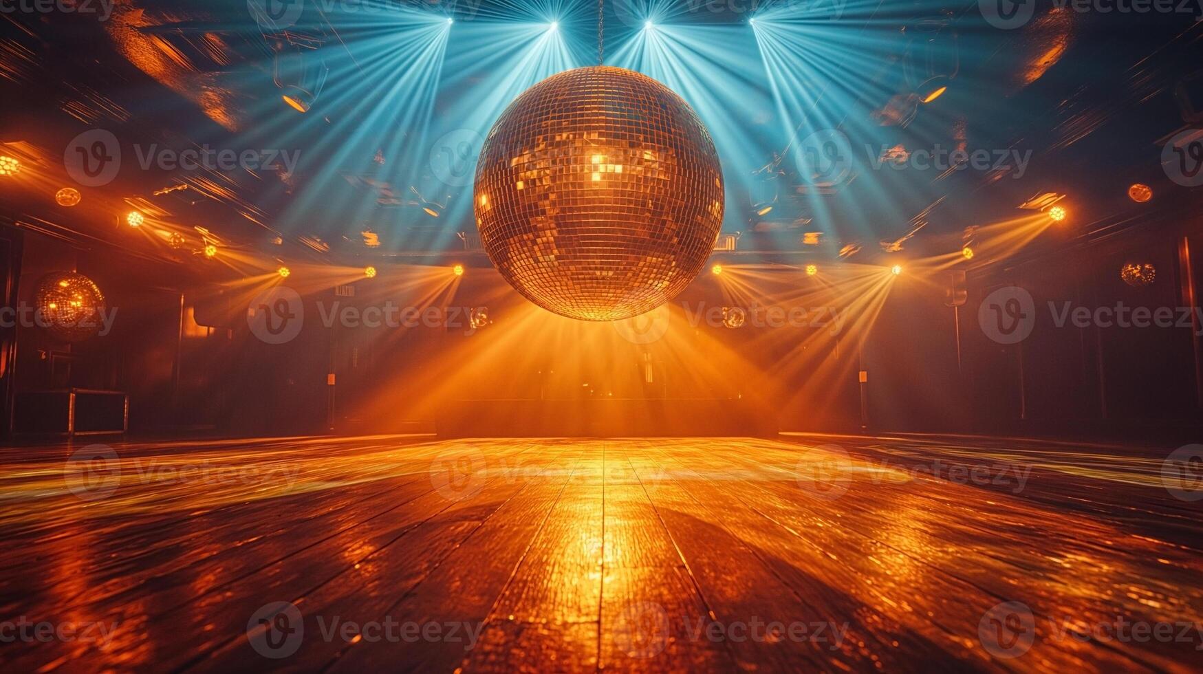A dazzling disco ball suspended in a vibrant dance floor setting, radiating warm lights in a lively atmosphere. photo