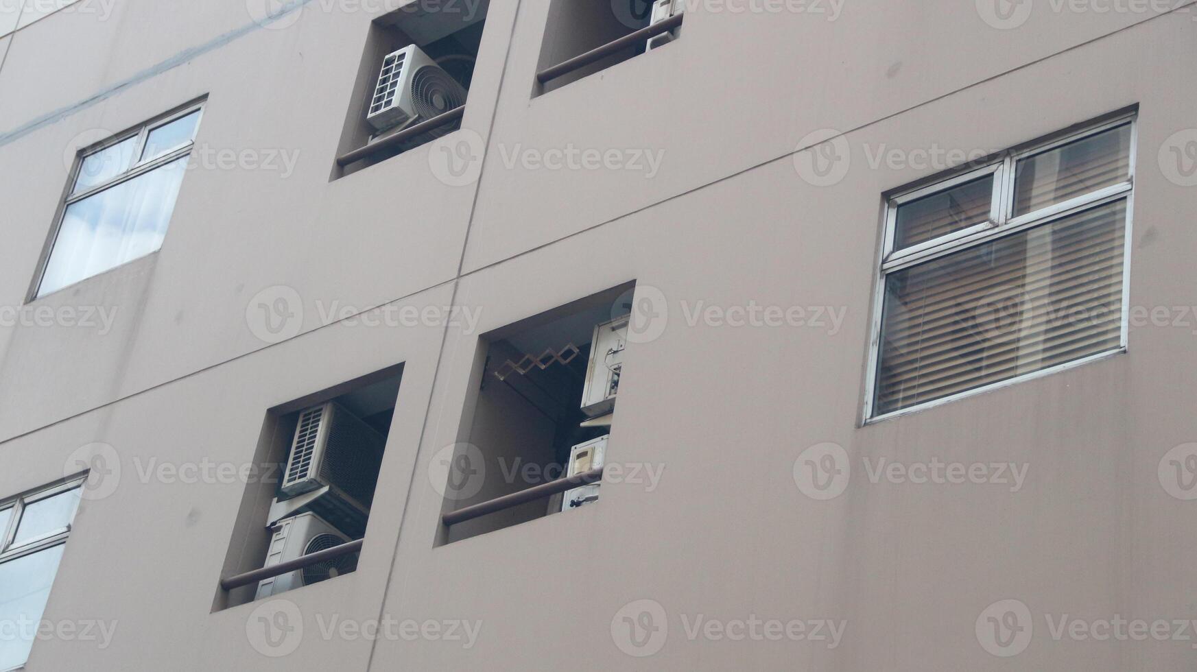 buildings, high-rise residential areas in the city. Abstract image of looking up at modern glass and concrete building. photo