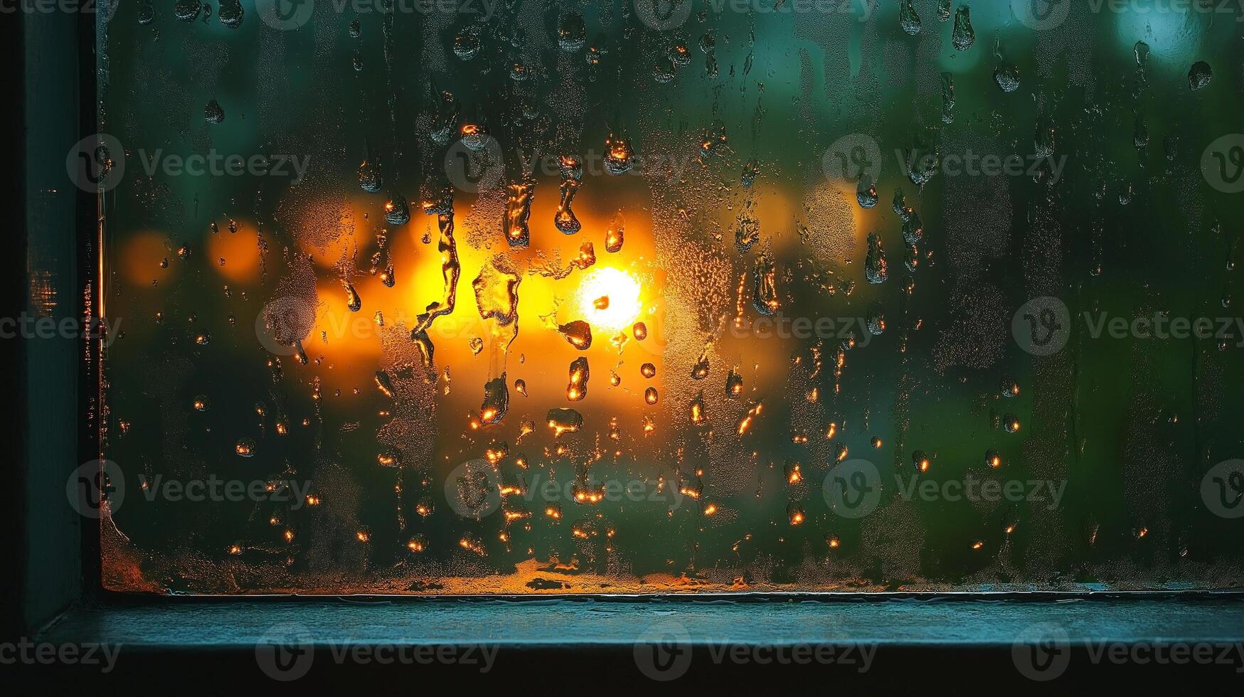 A close-up of raindrops on a window, creating a blurred view of warm lights outside, evoking a cozy, rainy evening atmosphere. photo