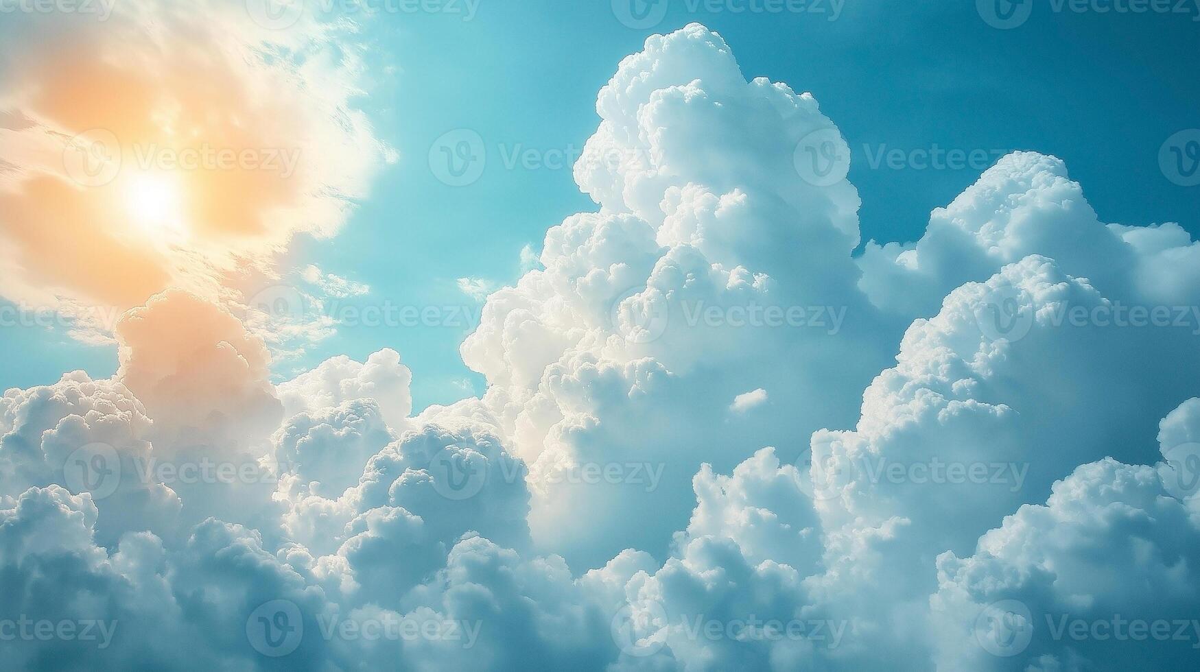 A breathtaking view of fluffy white clouds against a bright blue sky, illuminated by warm sunlight. photo