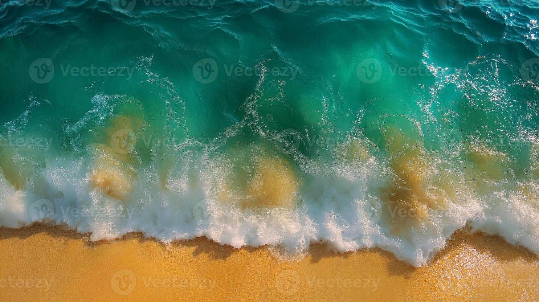 Crystal clear turquoise waves gently crashing on a sandy beach. photo