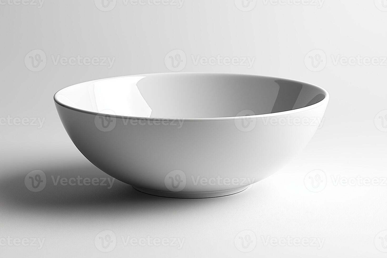 A minimalist, empty white ceramic bowl with a smooth finish on a clean background. photo