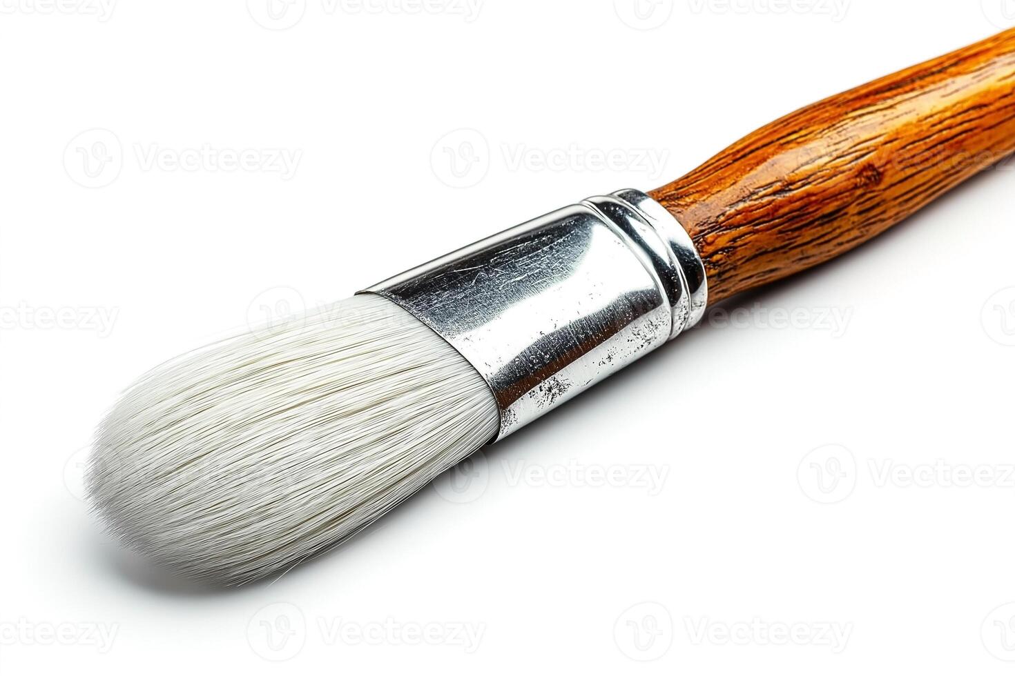 Close-up of a paintbrush with a wooden handle and soft bristles, ideal for artists and creative projects. photo