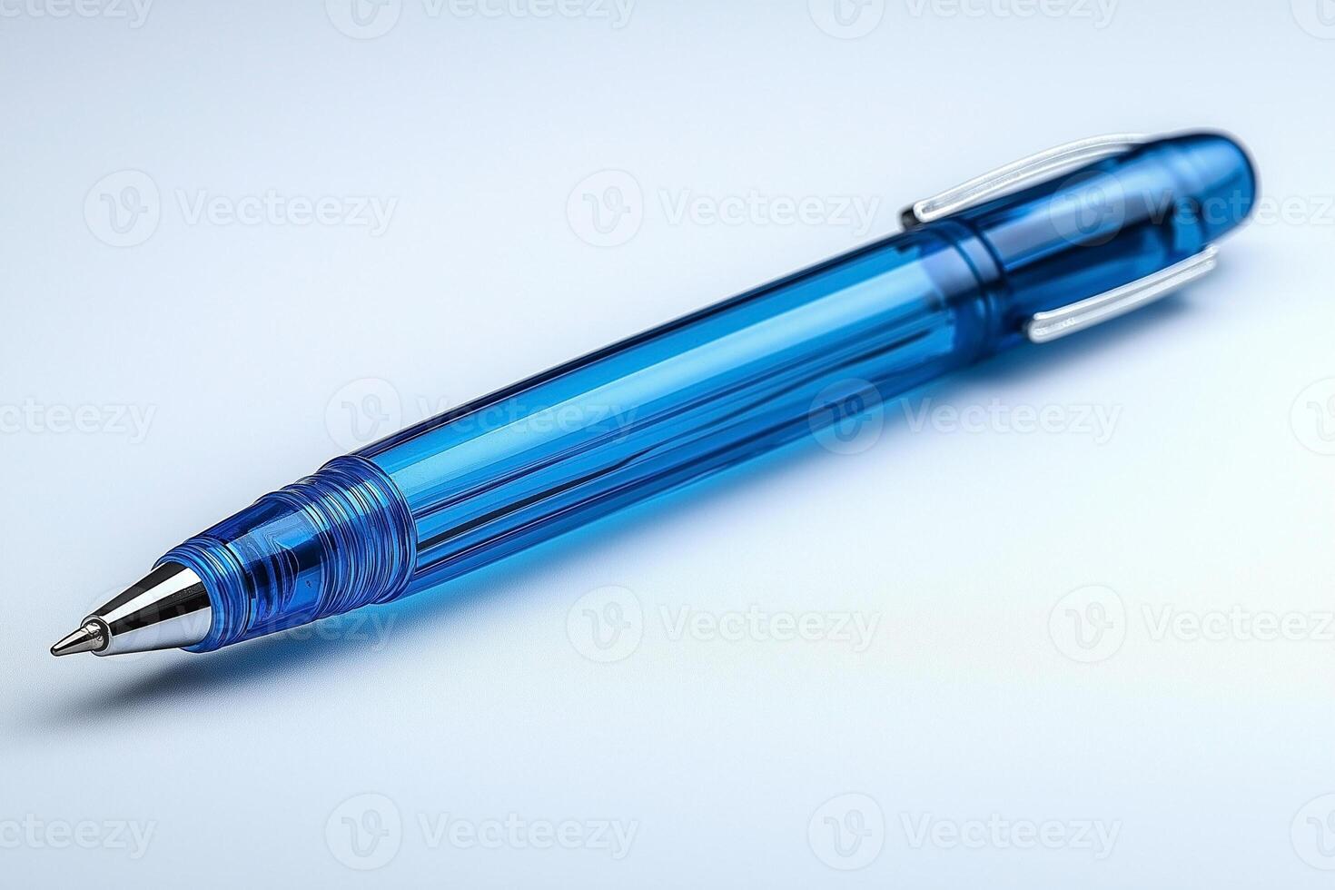 A clear, blue gel pen resting on a smooth surface, showcasing its sleek design and vibrant color. photo