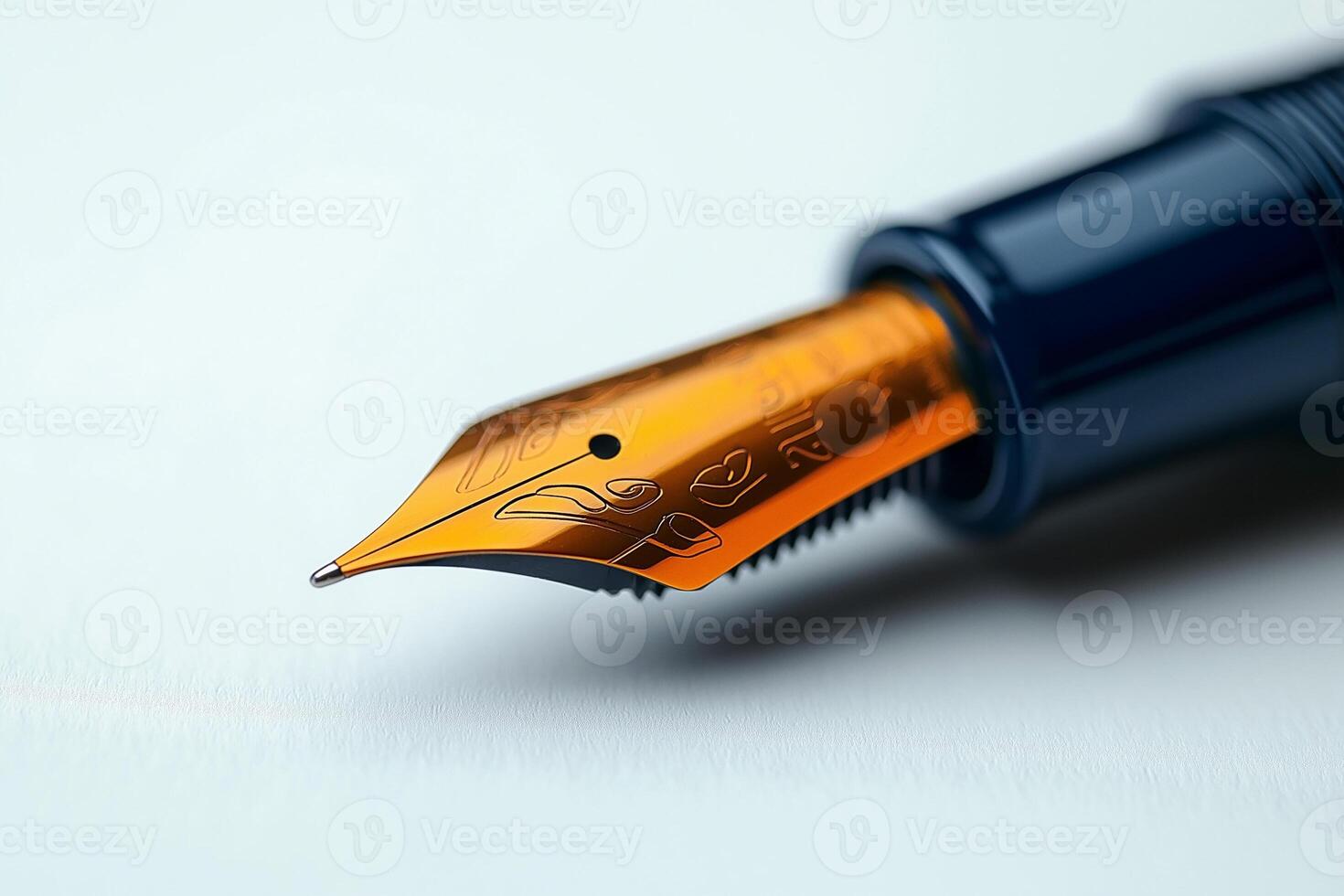 Close-up of a luxurious fountain pen nib, showcasing intricate details and a vibrant orange color. photo