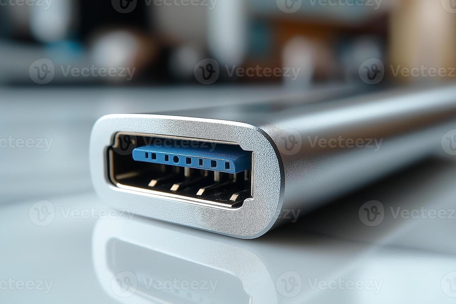 Close-up of a sleek silver USB hub, showcasing the blue USB ports with a modern, minimalistic design. photo