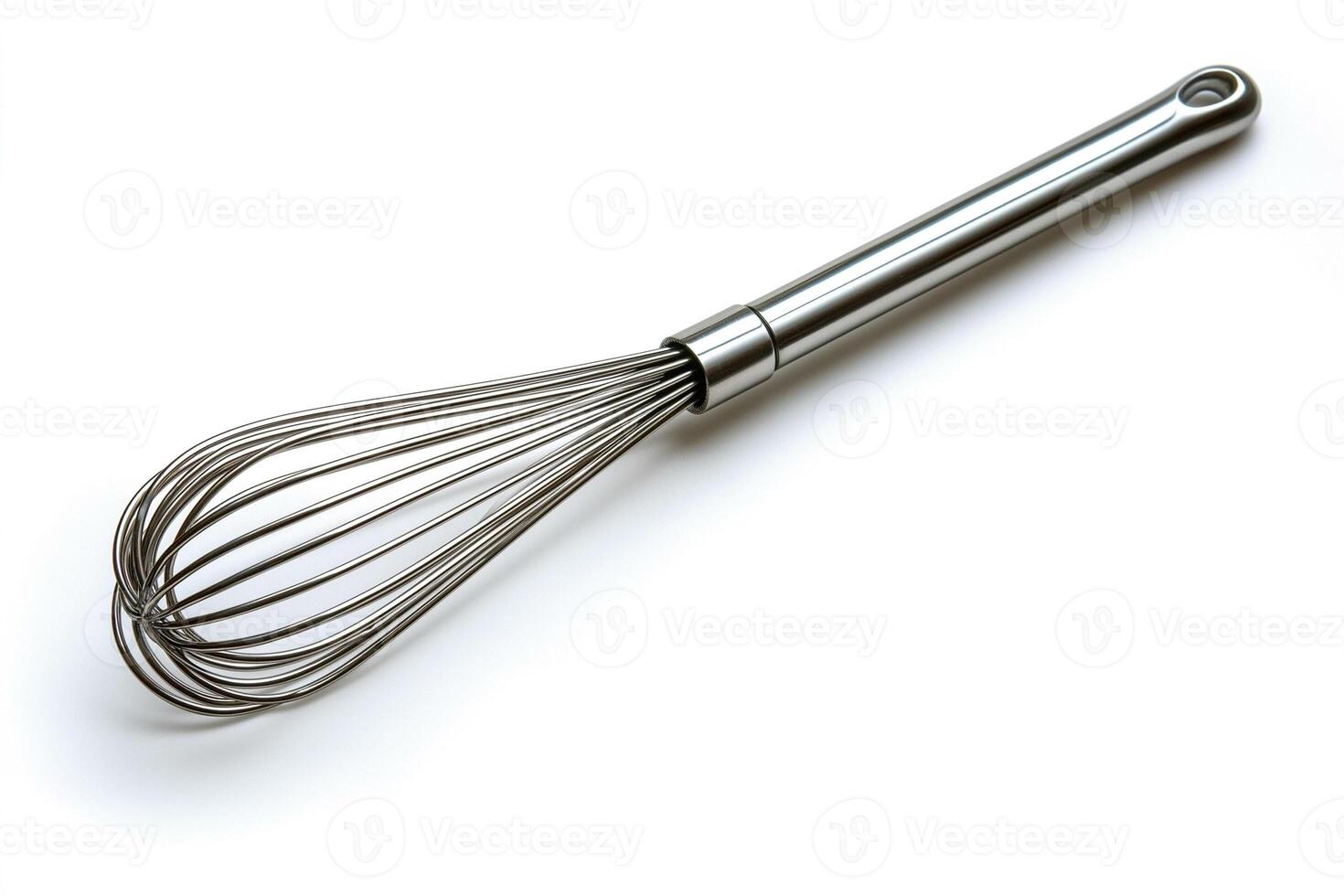 A stainless steel whisk showcased on a clean white background, ideal for blending and mixing ingredients in cooking. photo