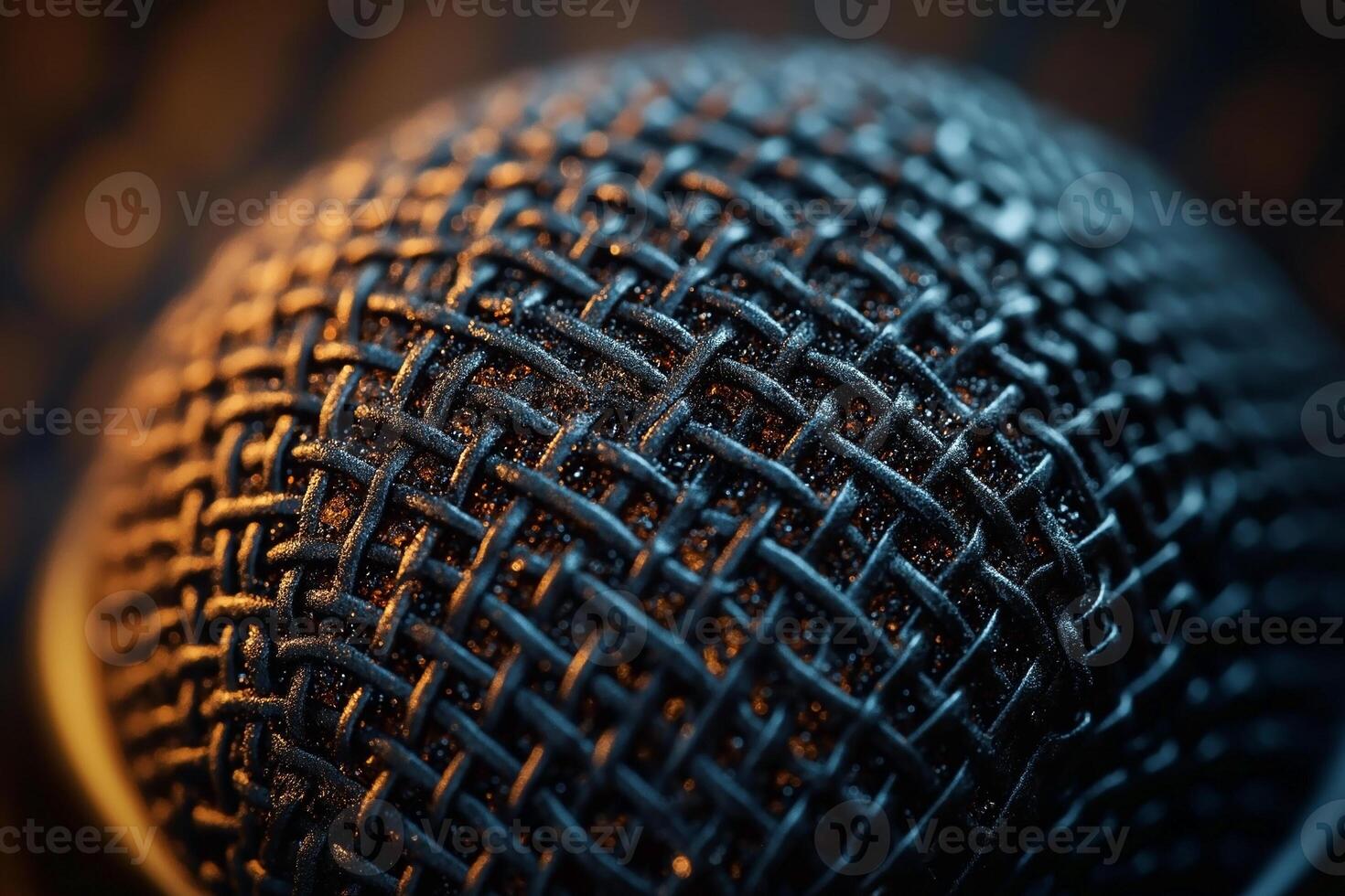 Close-up of a professional microphone mesh, showcasing intricate texture and details under warm lighting. photo