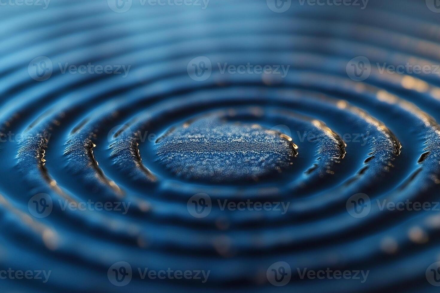 Close-up of concentric water ripples on a blue surface, creating a serene and calming effect. photo