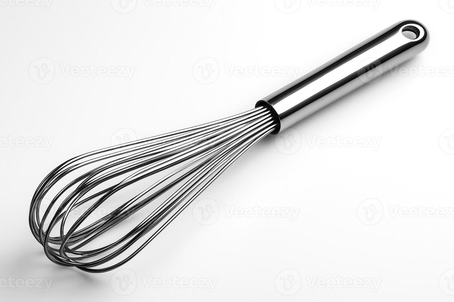 Close-up of a sleek stainless steel whisk, perfect for whipping, mixing, and preparing delicious recipes. photo