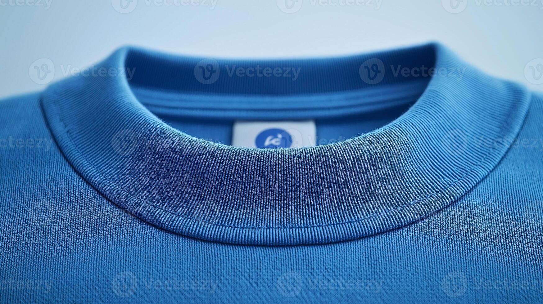 Close-up of a blue cotton t-shirt collar, showcasing its soft fabric and detailed stitching. photo