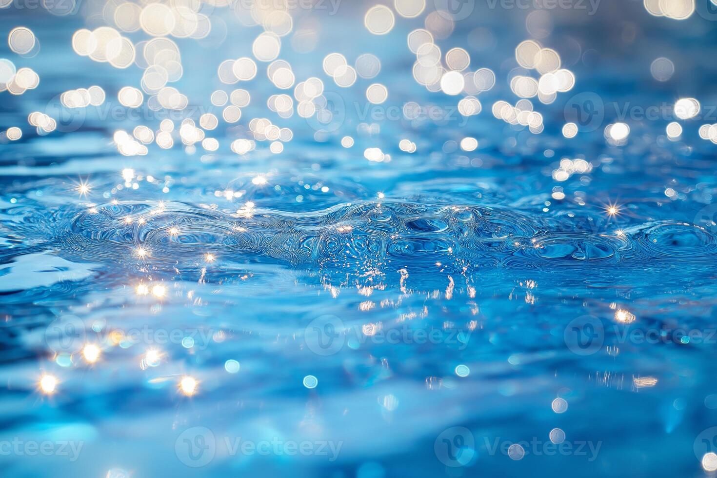 Glistening blue water surface with shimmering reflections, creating a tranquil and refreshing atmosphere. photo