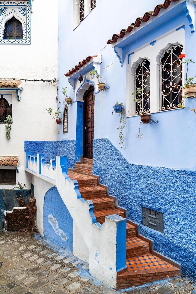Chefchaouen, Morocco-march 26, 2024-particular of the narrow alleys in Chefchaouen the blue city during a cloudy day photo