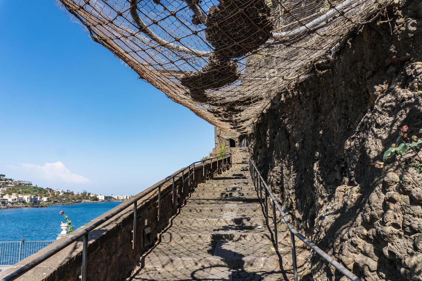Sicily, Italy-May 11, 2022-Stairs inside the ruins of a Norman fortress built on an imposing cliff overlooking the sea, photo