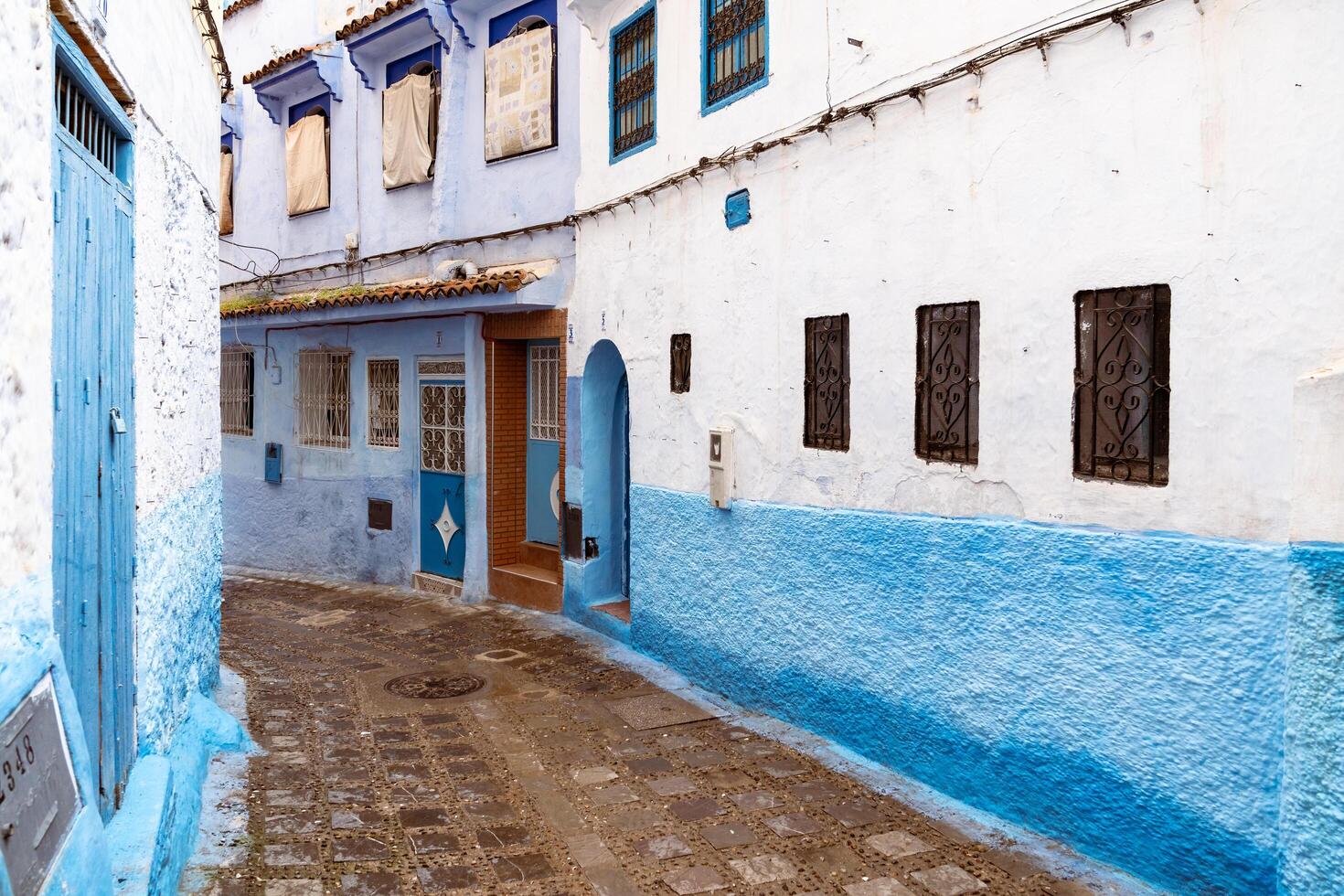 Chefchaouen, Morocco-march 26, 2024-particular of the narrow alleys in Chefchaouen the blue city during the cloudy day. photo