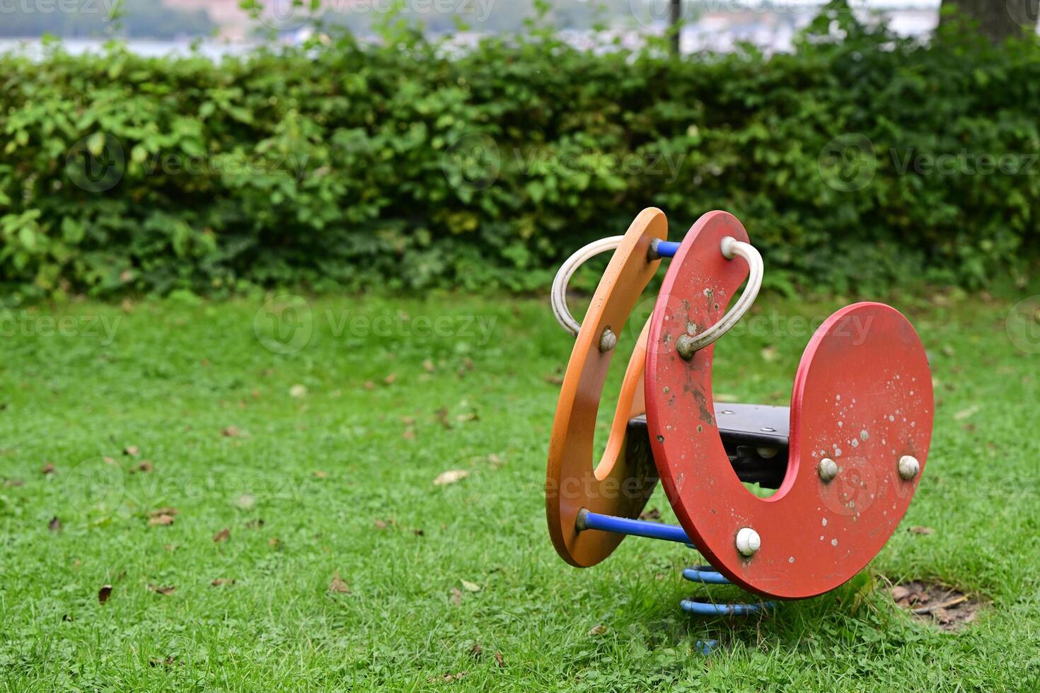 Colorful Spring Rider Horse in a Playground photo