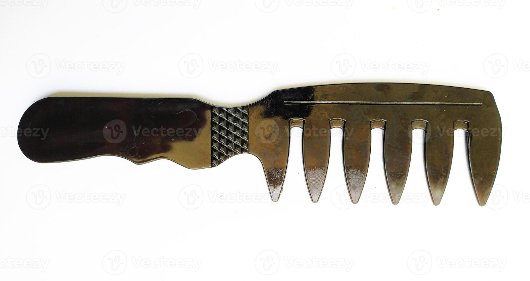 Sleek black widetooth comb, isolated on white. Perfect for beauty, hair care, or minimalist design concepts. Its smooth, dark surface adds a touch of elegance. photo