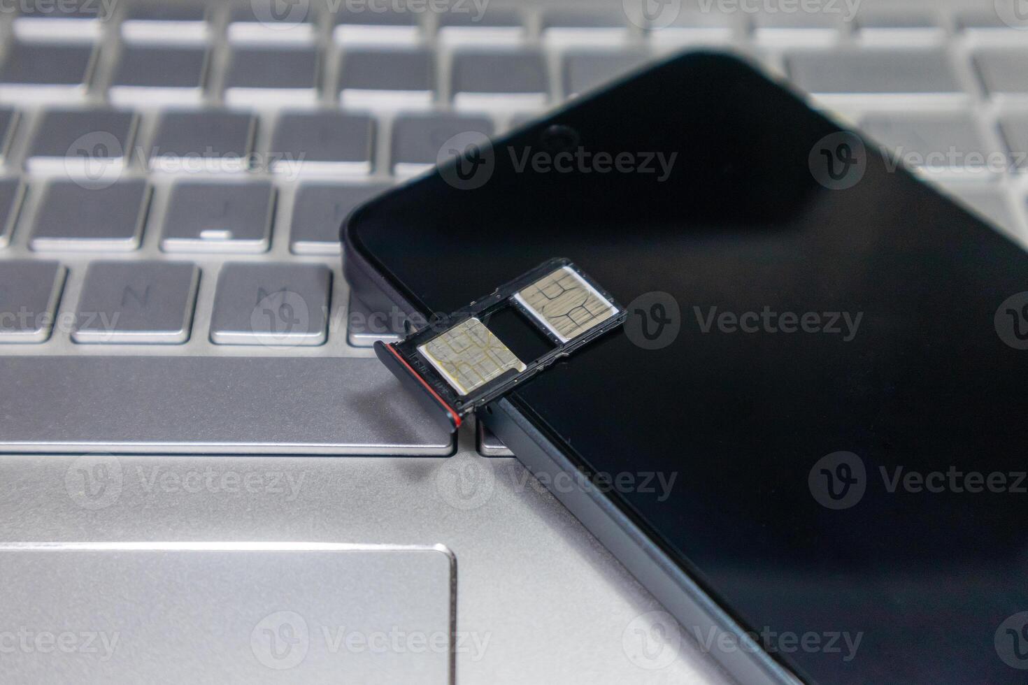 An open SIM card slot on a smartphone photo