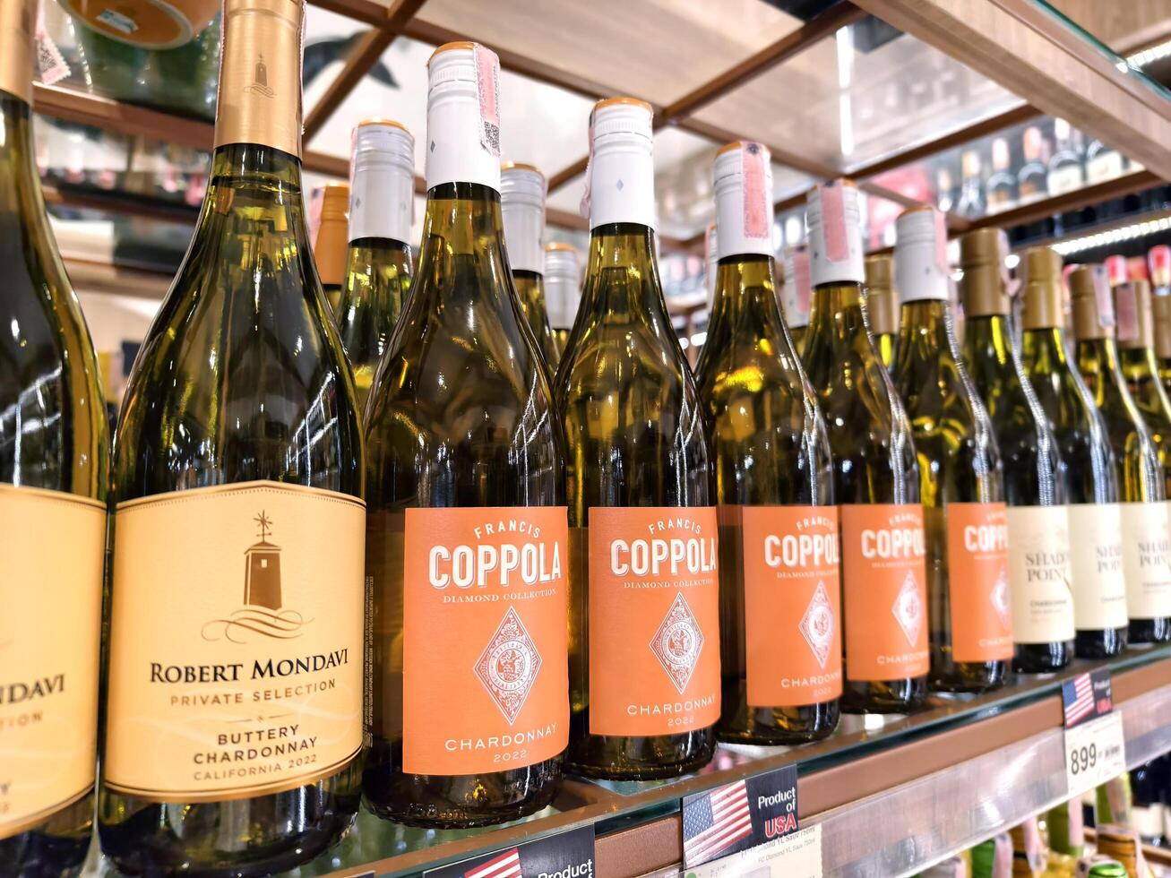 PHUKET, THAILAND - MARCH 8, 2025. A retail store that is filled with numerous bottles of various wine photo