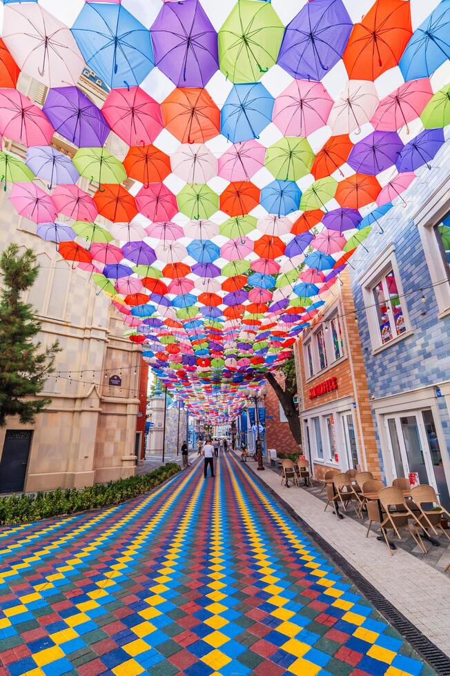 Multicolored bright colorful umbrellas decoration Magic City Park in Tashkent. Tashkent, Uzbekistan - June 15, 2024 photo