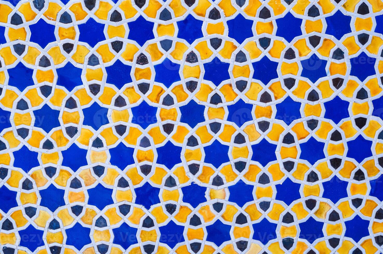yellow and blue ceramic tiles with an abstract geometric pattern. Background with uzbek ornament photo