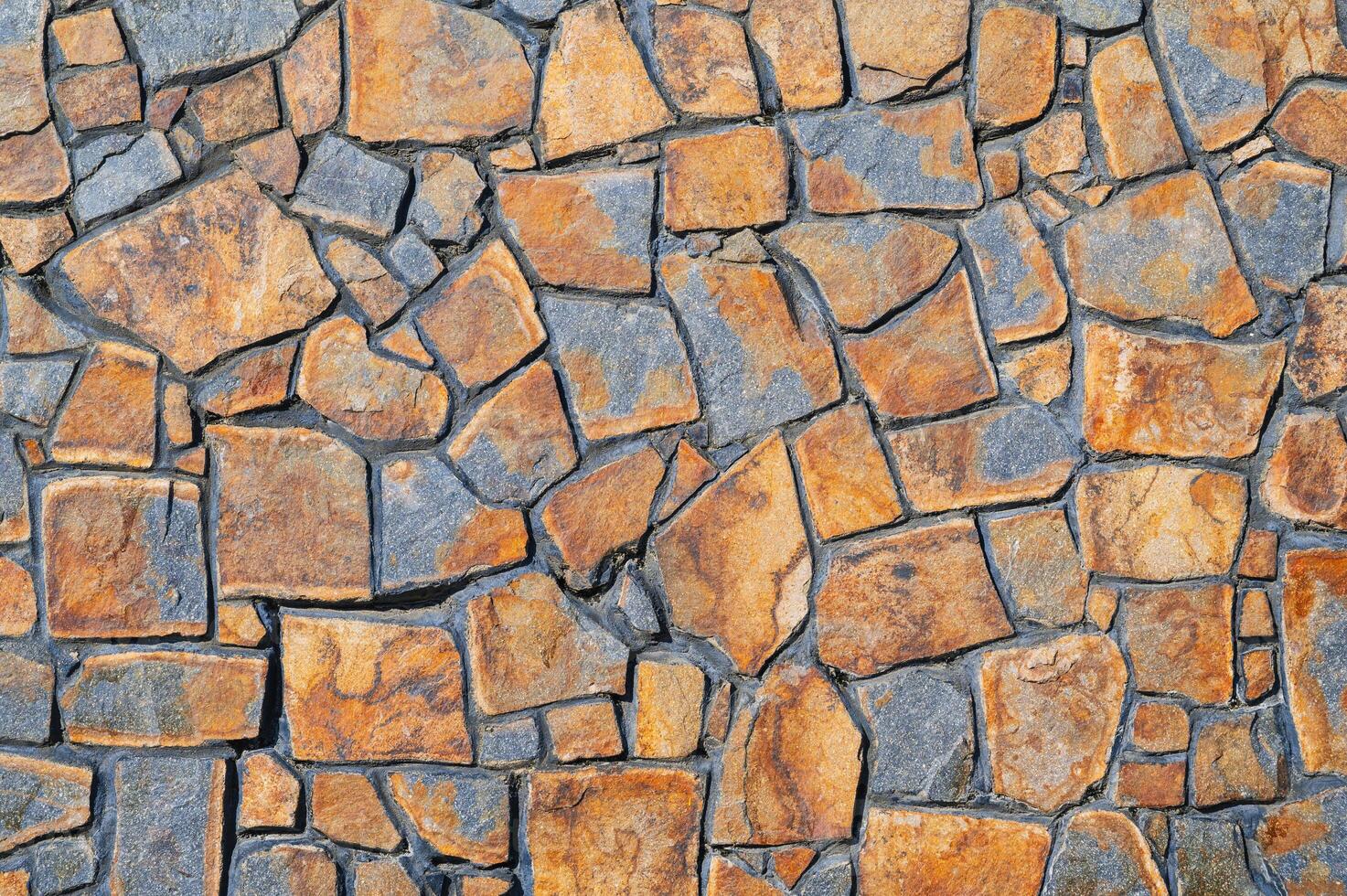 The texture of the walls is made of brown-gray stone, the background of the floor. photo