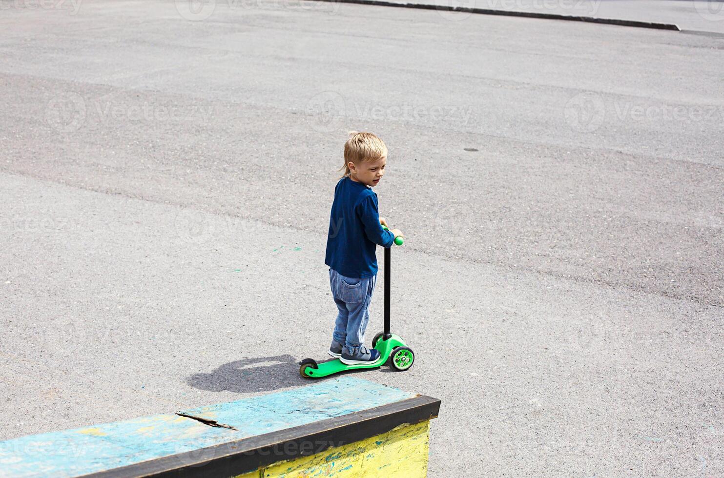 Little Kid on Scooter for Playtime Fun. Childhood Outdoor Activities, Promoting an Active Lifestyle. photo