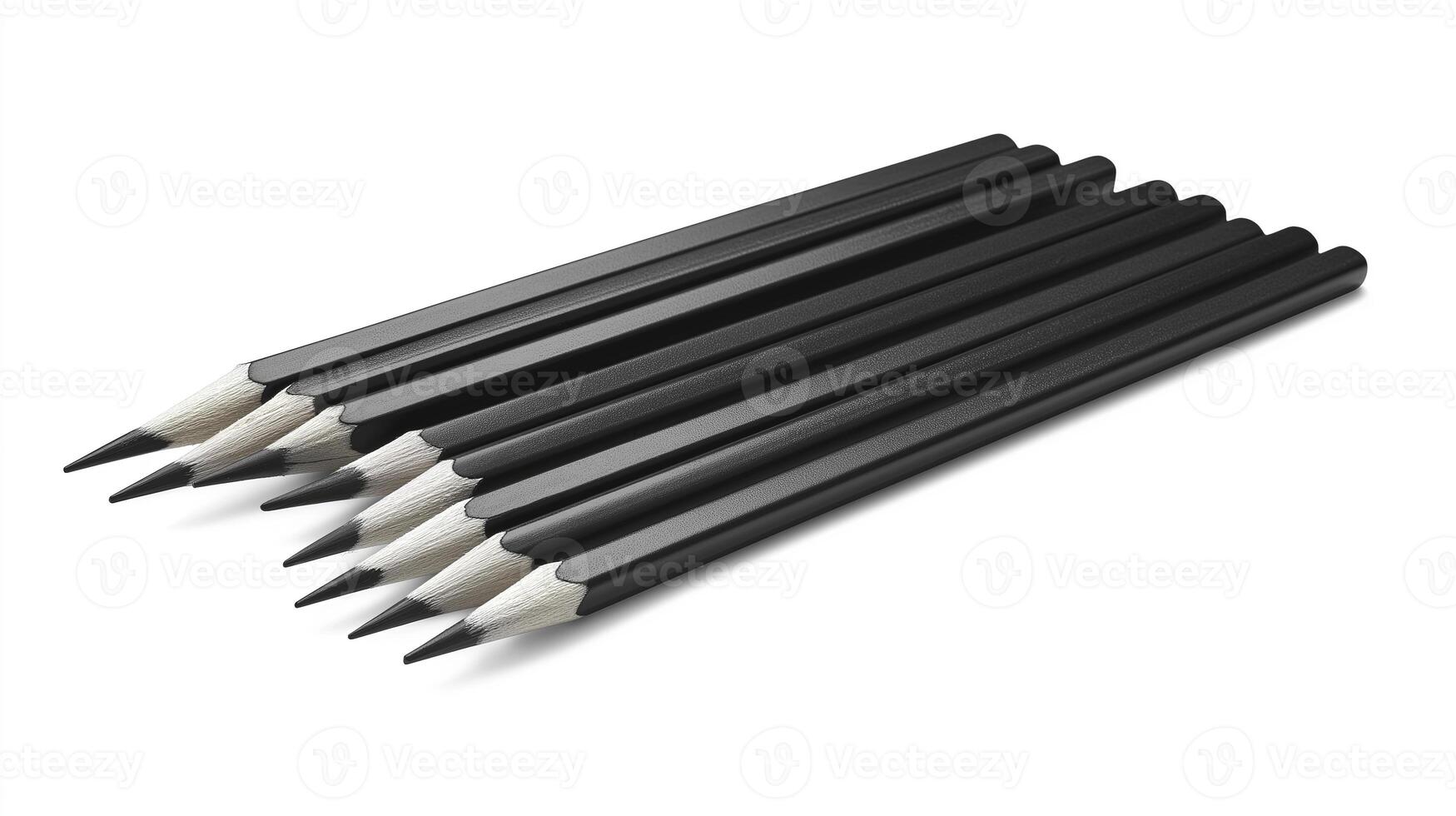 Neatly aligned row of identical black pencils, showcasing minimalist design and sharp tips, perfect for artistic expression photo