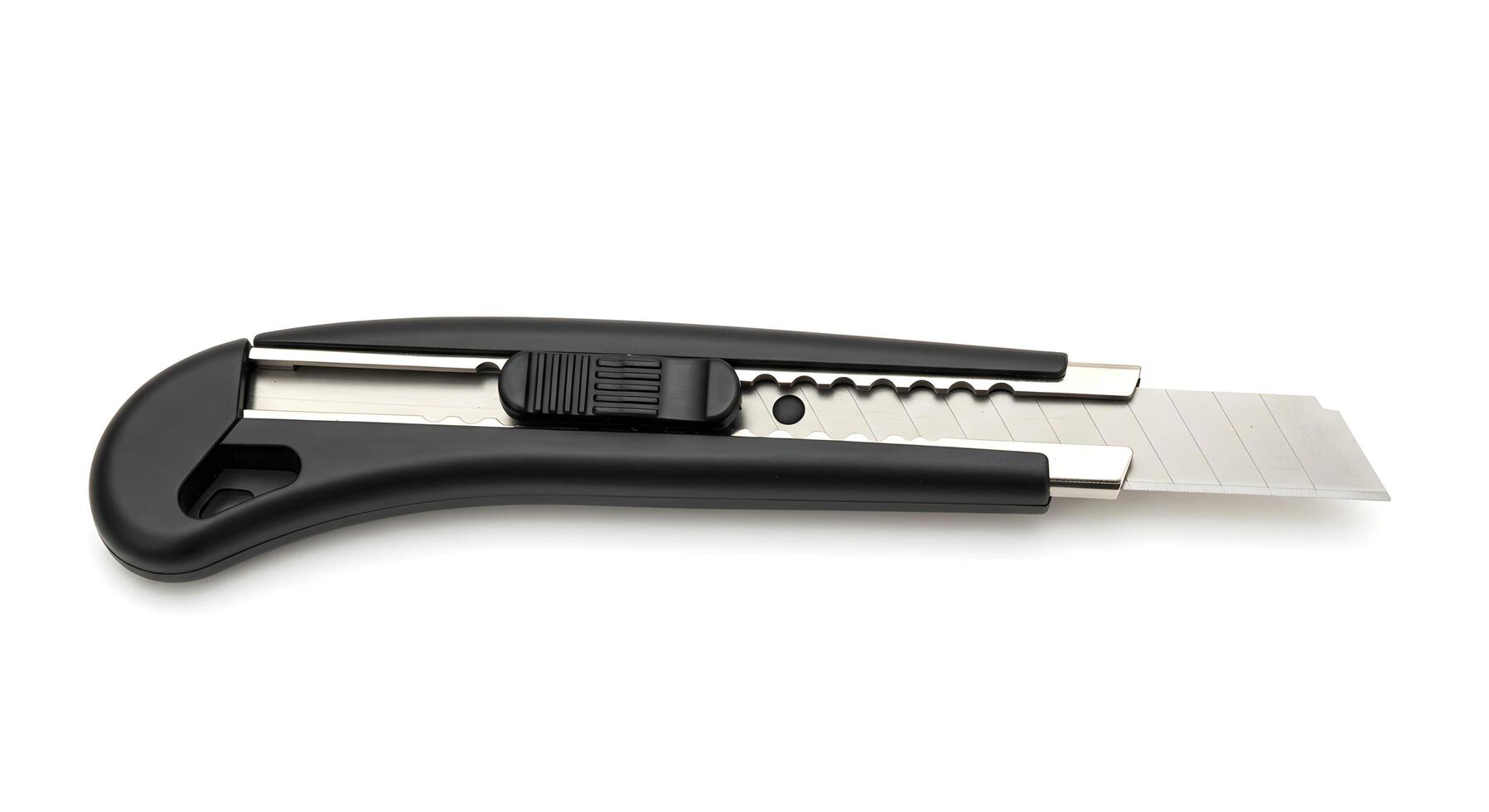 Utility Knife with Retractable Blade on White Background for Cutting photo