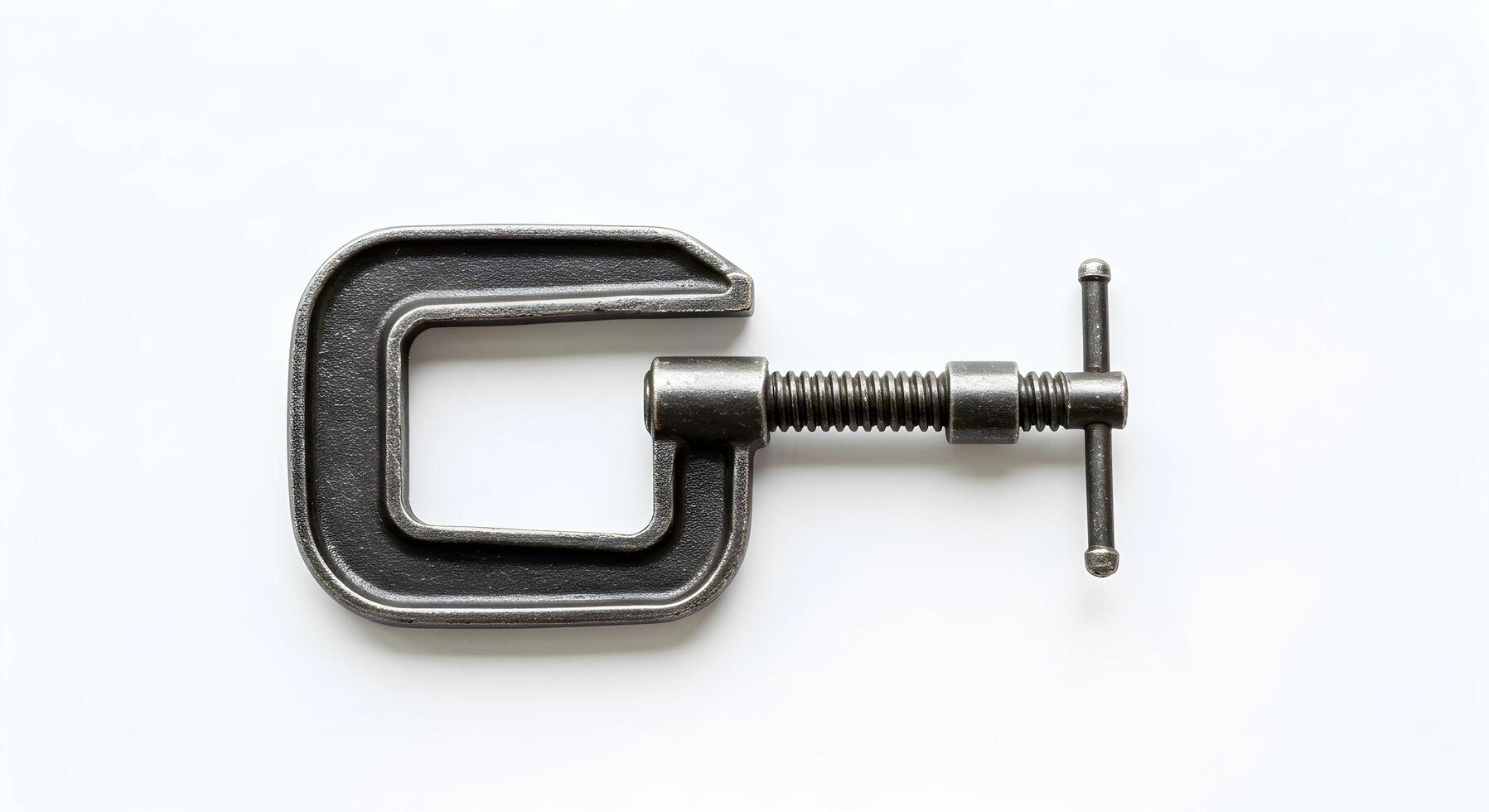 Close Up of a Metallic C-clamp Tool on White Background photo