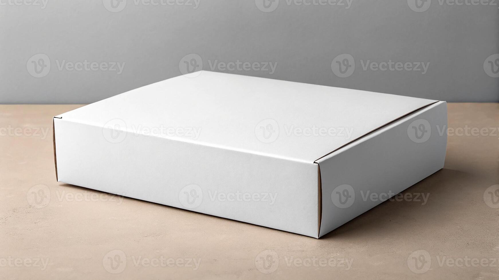 A clean, empty white box on a textured surface ready for branding or packaging. photo