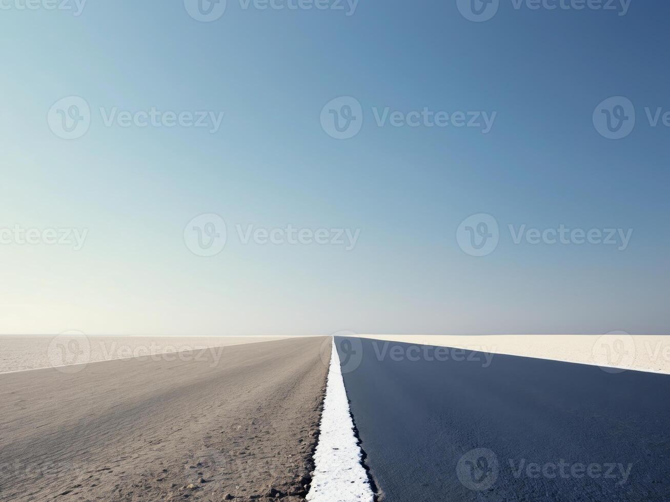 A long empty road with a white line on the side photo