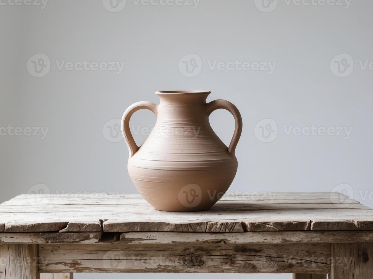 Handcrafted Clay Jug Pottery Vessel on Rustic Wooden Table. photo
