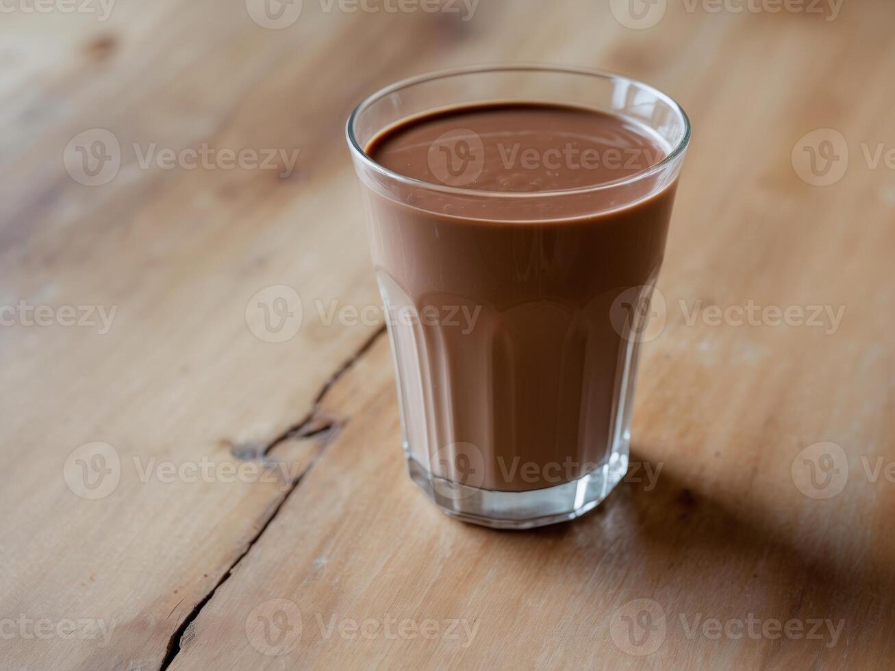Glass chocolate milk wooden table is filled to Delicious presented photo