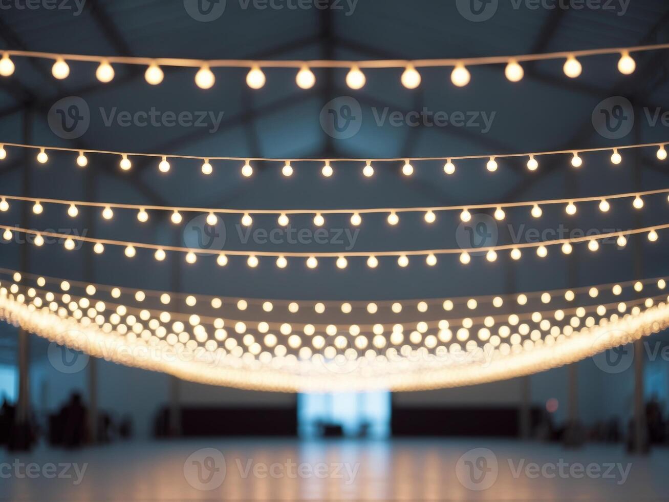 Large open space high ceiling string lights hanging Blurred background of party. photo
