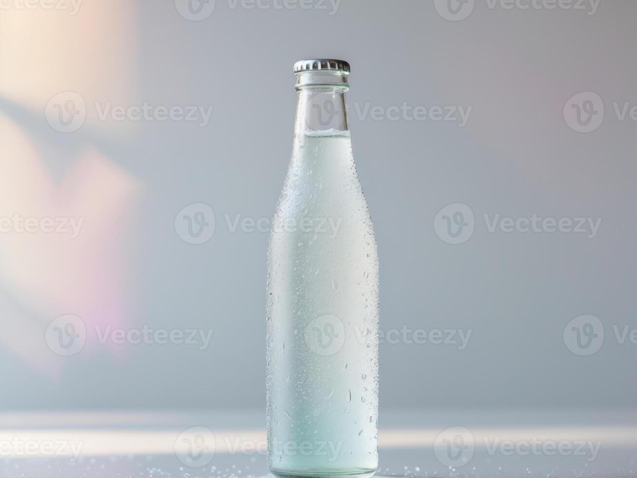 A bottle of soda water sitting on a table photo