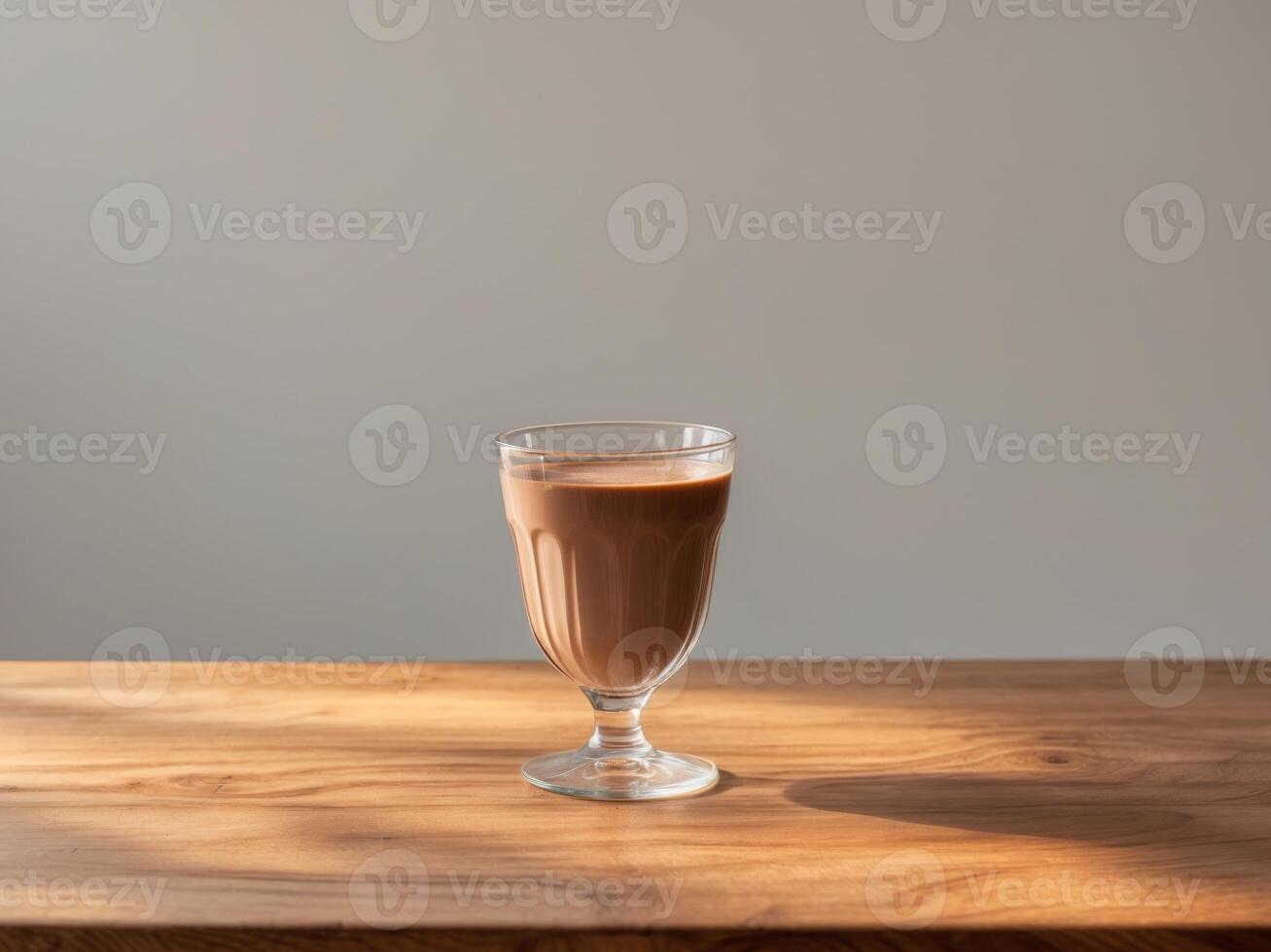 Glass chocolate milk wooden table is filled to Delicious presented. photo