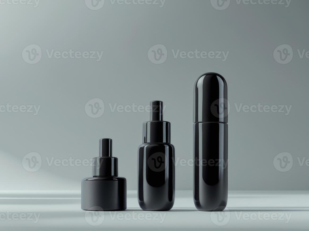 Three black bottles with different sizes and shapes photo