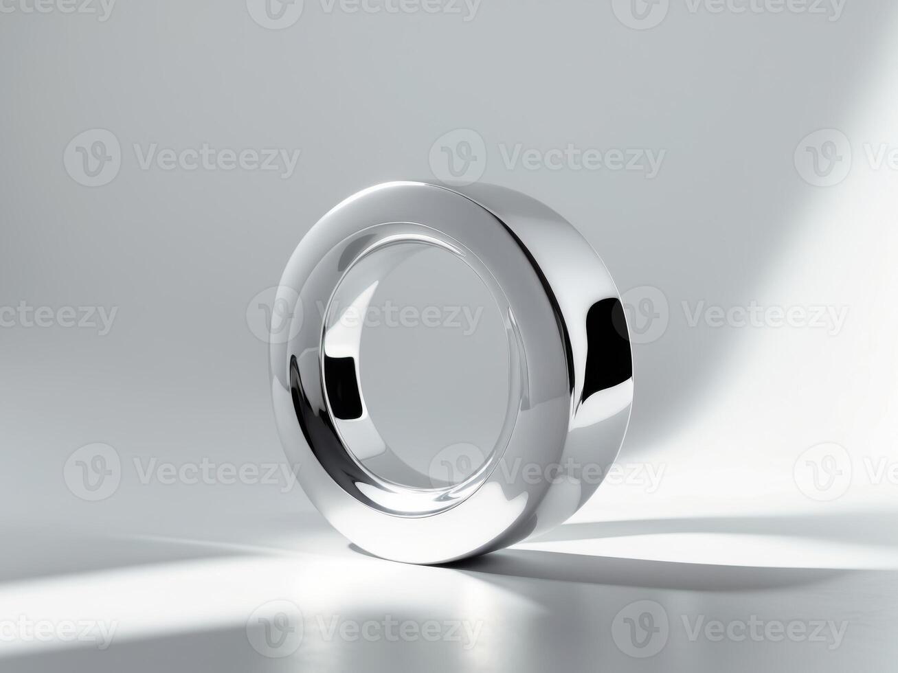 A ring is shown on a white surface photo